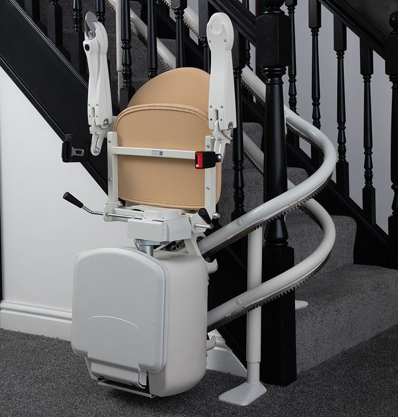 Curved spiral stairlift chair custom-fitted to winding staircase South Africa — Stair Lift Chair